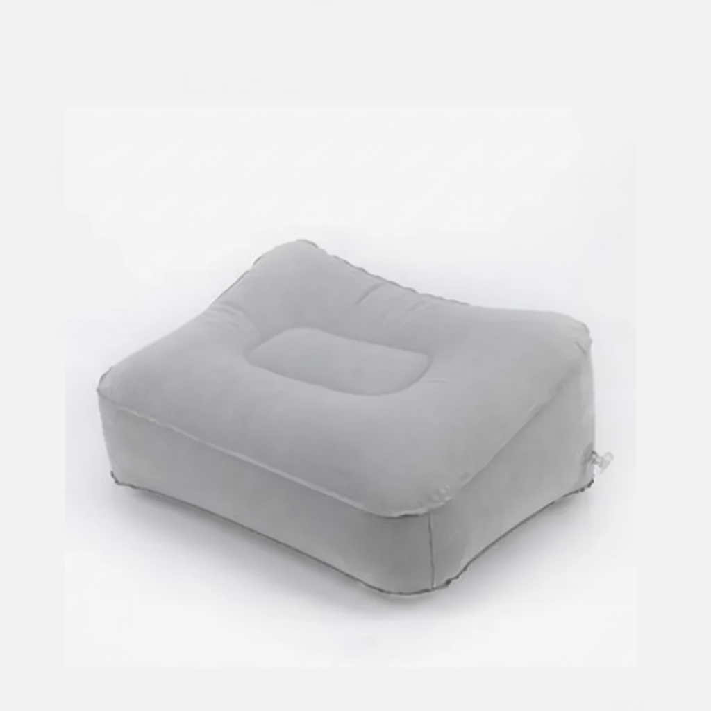 Inflatable travel footrest pillow with adjustable firmness for leg support