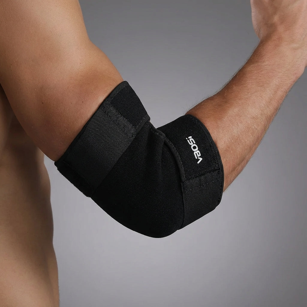 Adjustable elbow support wrap with gentle compression and breathable construction