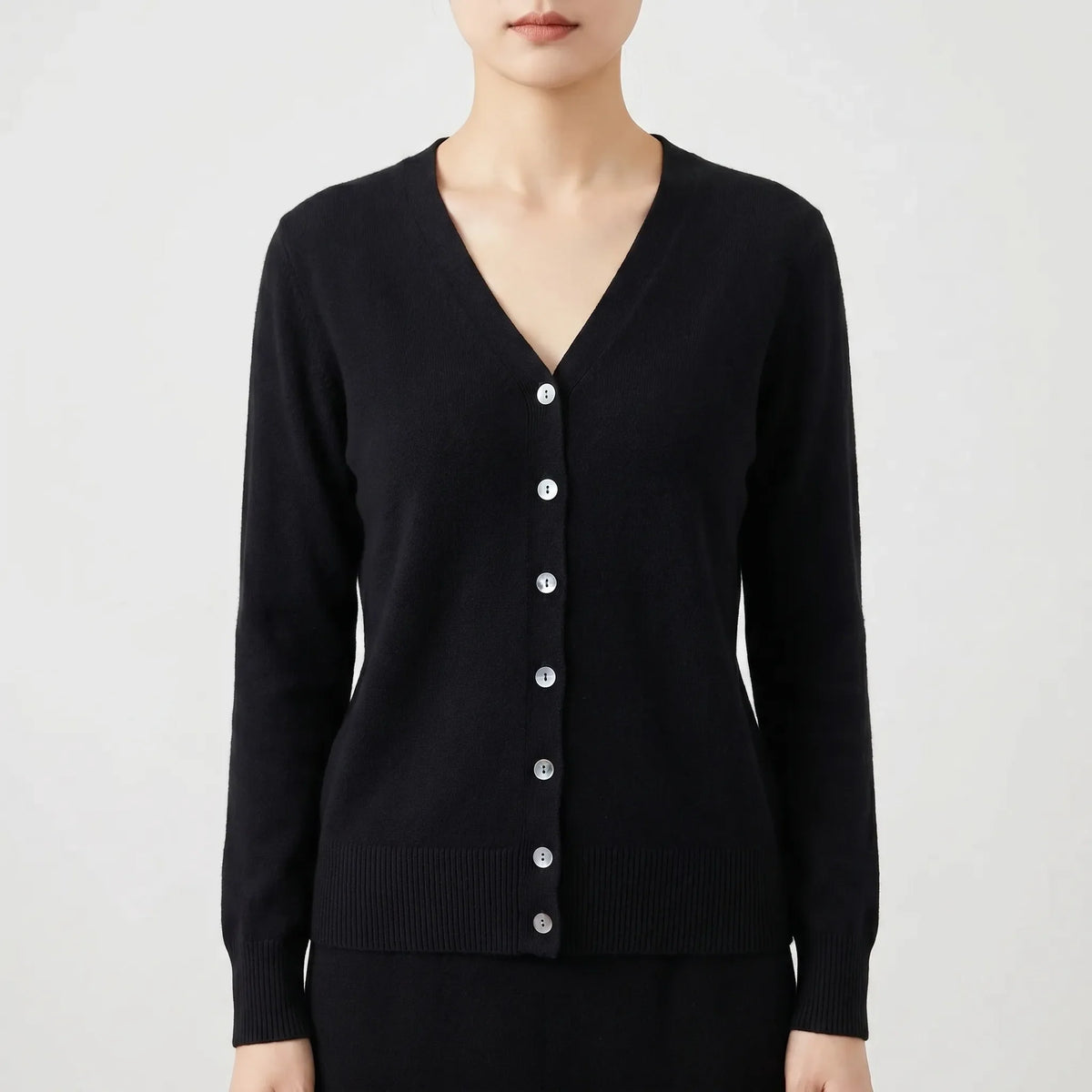 Women's V-neck cardigan with fine knit construction and button-up front