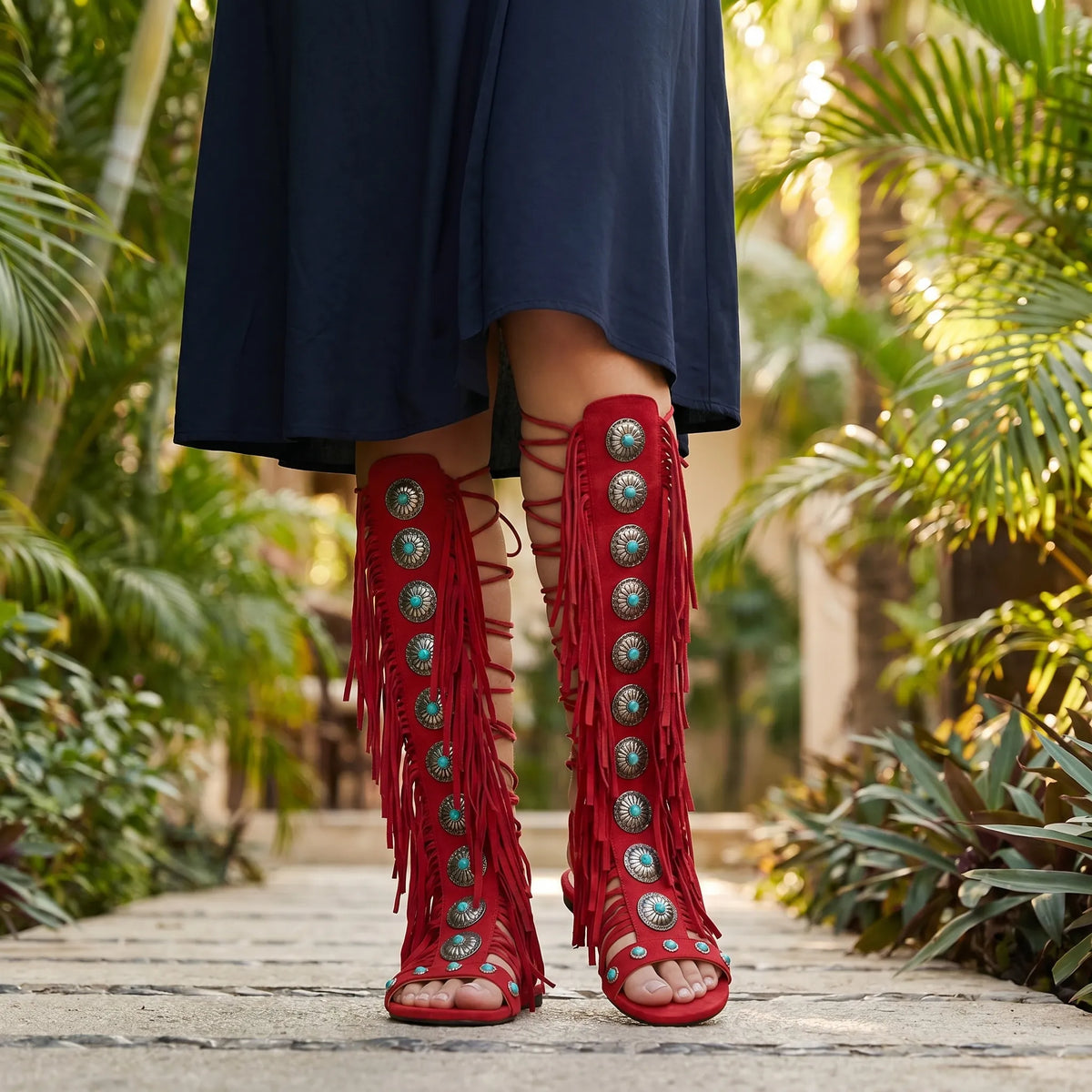 Ankle-high fringe sandals with lace-up closure and metallic stone details