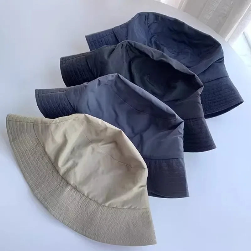 Wide-brim bucket hat with water-repellent fabric and extended sizing