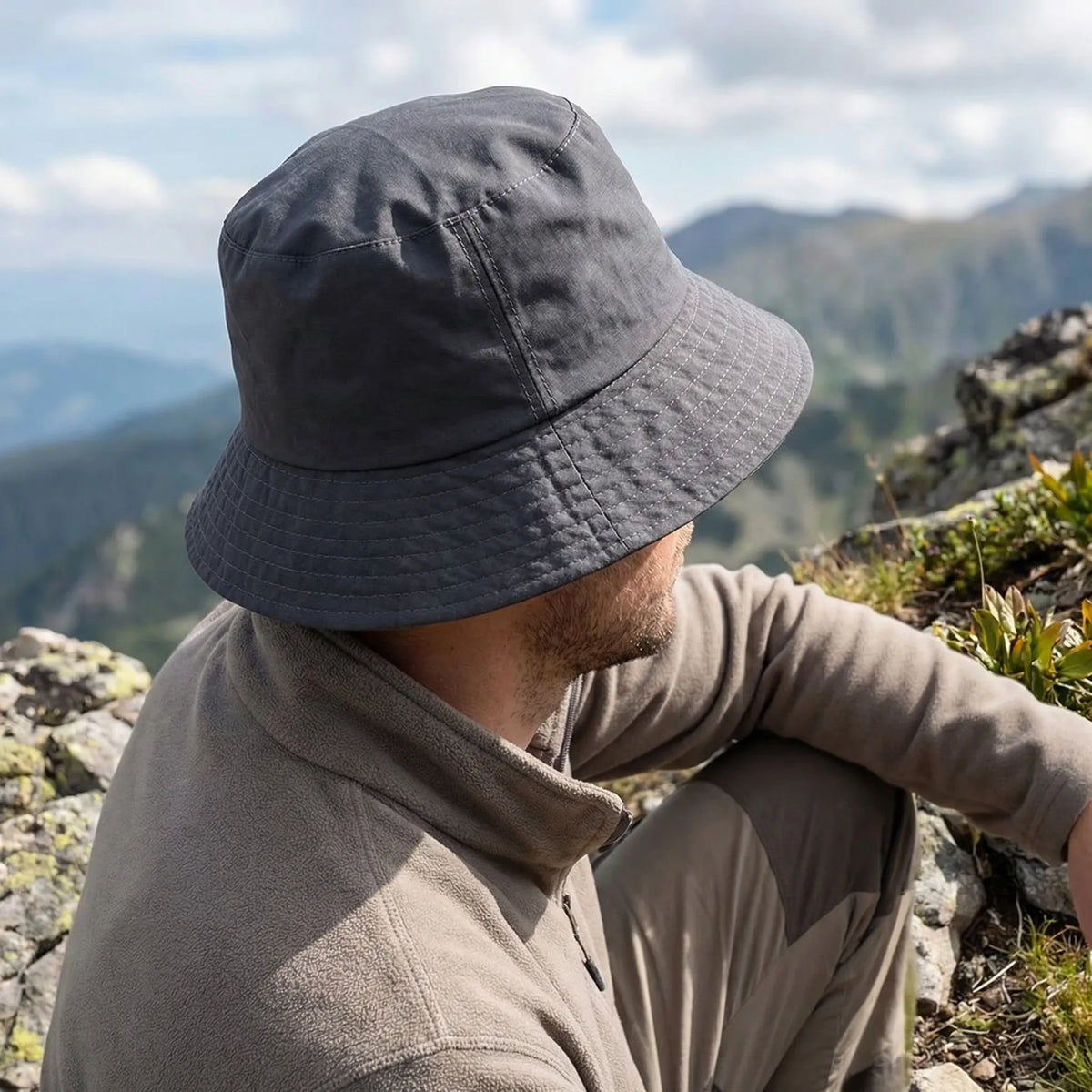 Wide-brim bucket hat with water-repellent fabric and extended sizing