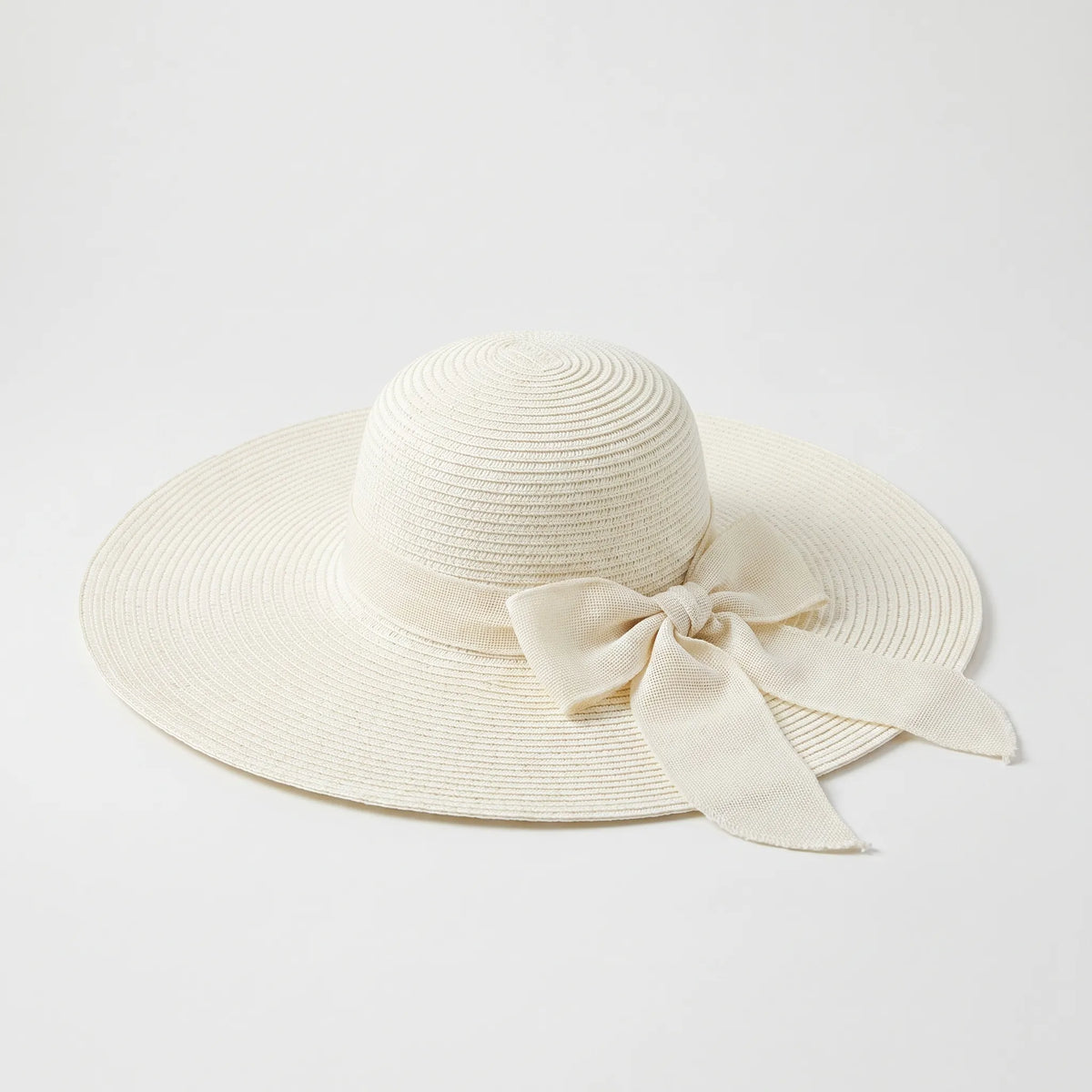 Wide brim women's summer hat with floppy design and bow detail
