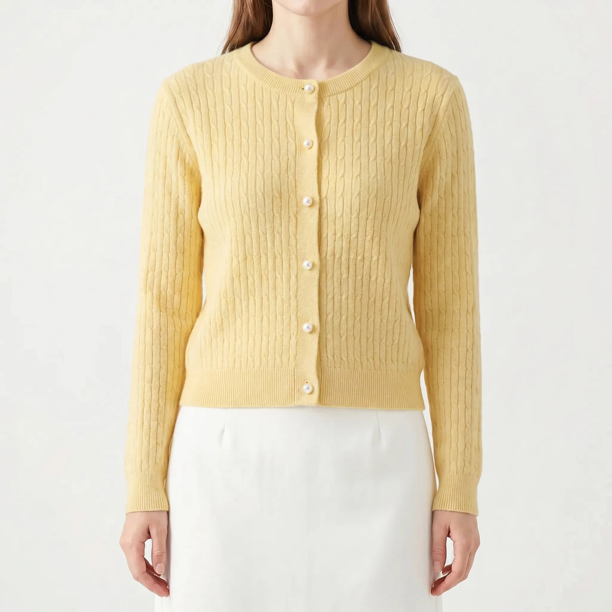 Women's cable knit cardigan with pearl-style buttons and ribbed details