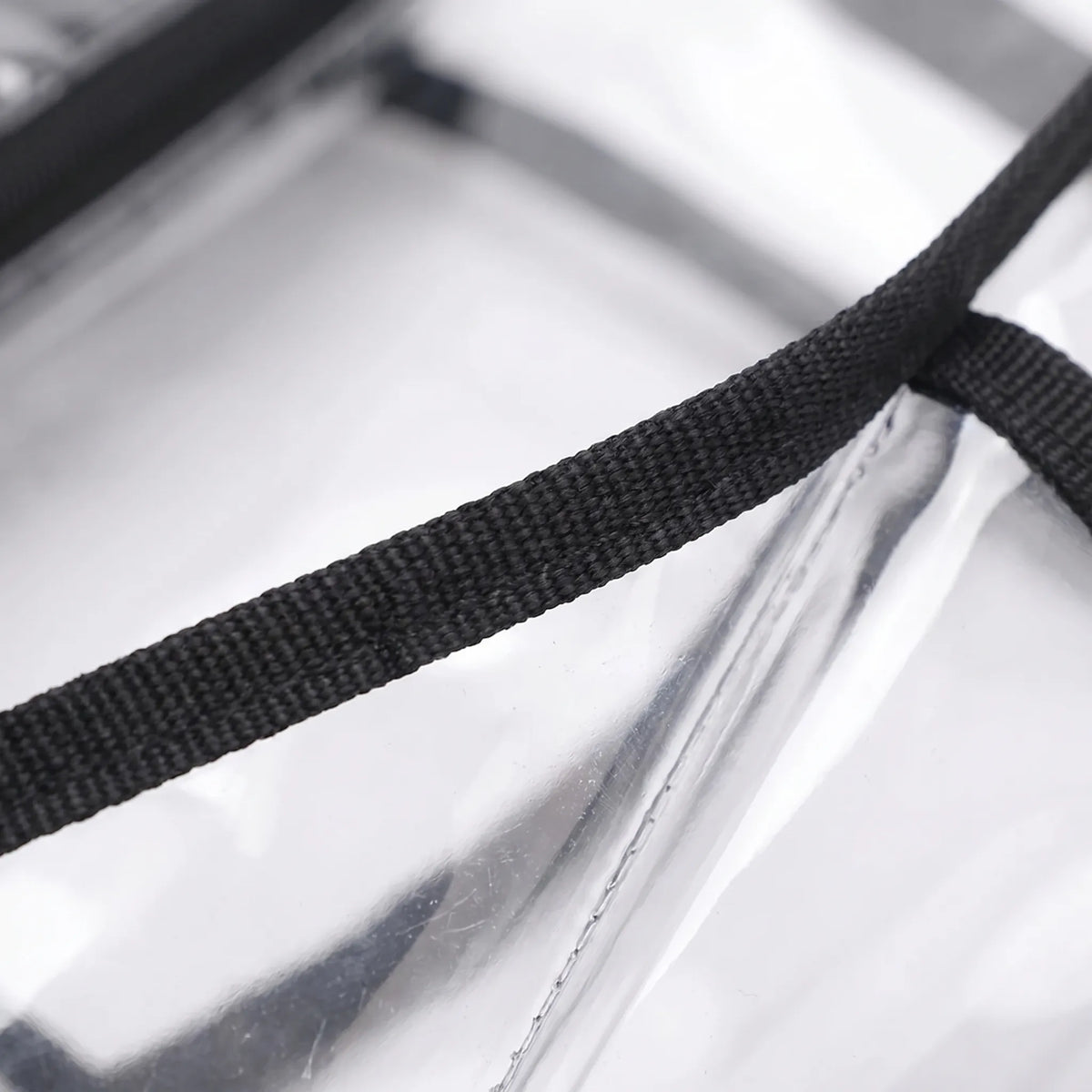 Transparent crossbody bag with mesh front pocket and adjustable strap