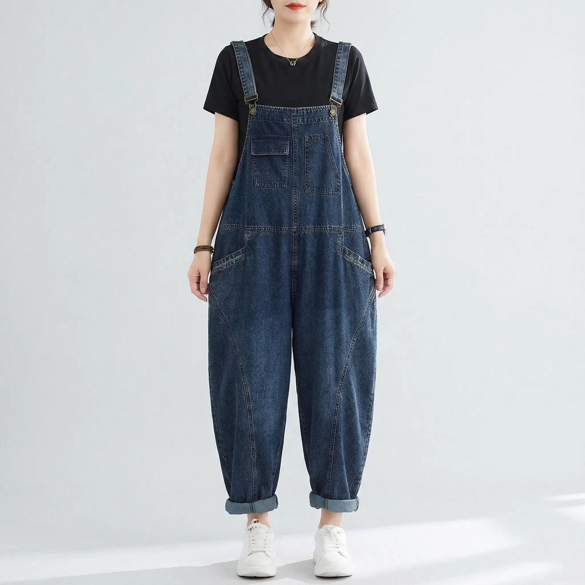 Relaxed fit denim dungarees with harem-style legs and patchwork panel details