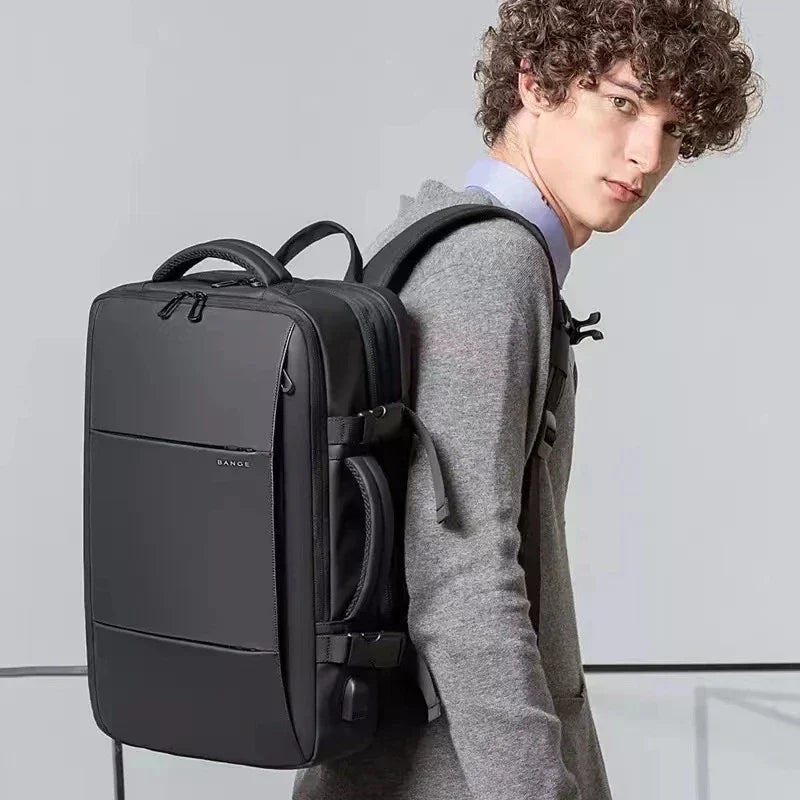 Expandable business backpack with padded laptop pocket and USB port