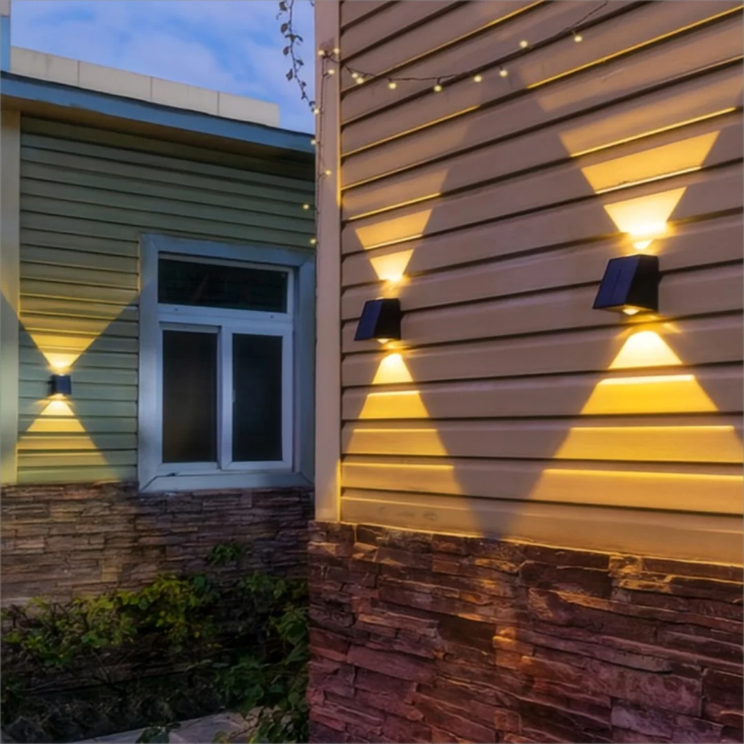 Solar-powered outdoor wall light with dual up-down beam pattern