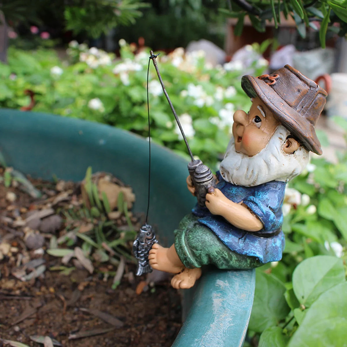 Seated fishing gnome with hand-painted detail, UV-resistant outdoor garden statue