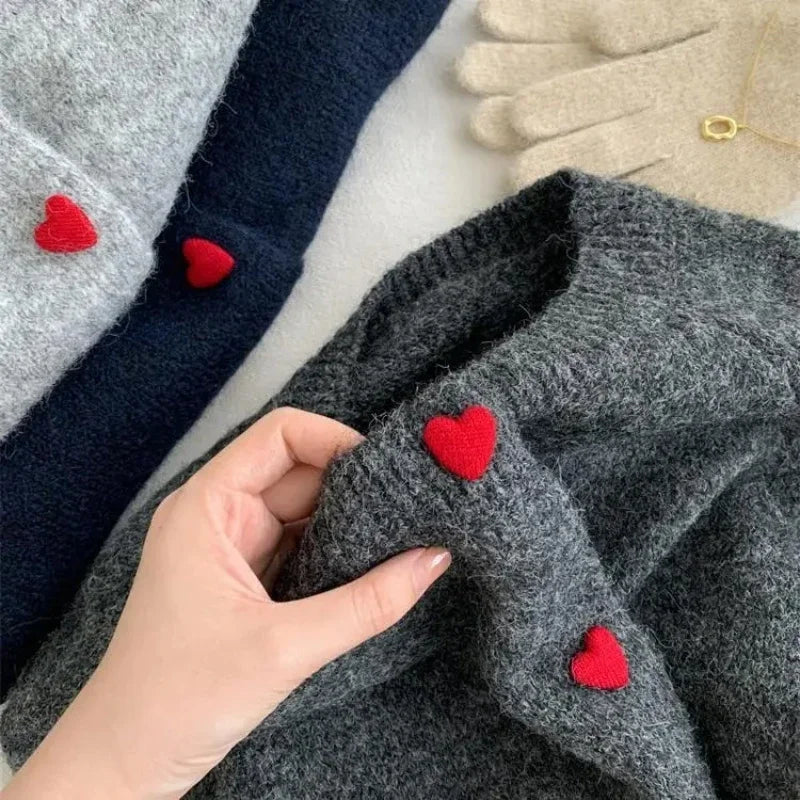 Deep grey chunky knitted cardigan with dropped shoulder sleeves and heart buttons