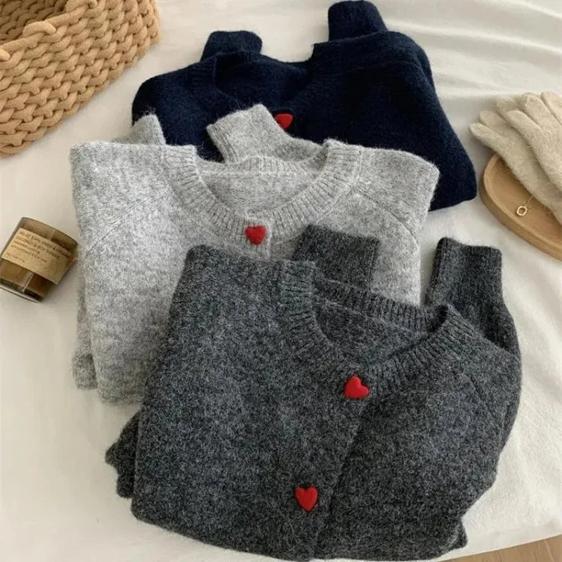 Deep grey chunky knitted cardigan with dropped shoulder sleeves and heart buttons