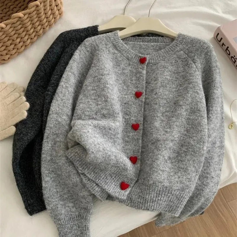 Deep grey chunky knitted cardigan with dropped shoulder sleeves and heart buttons