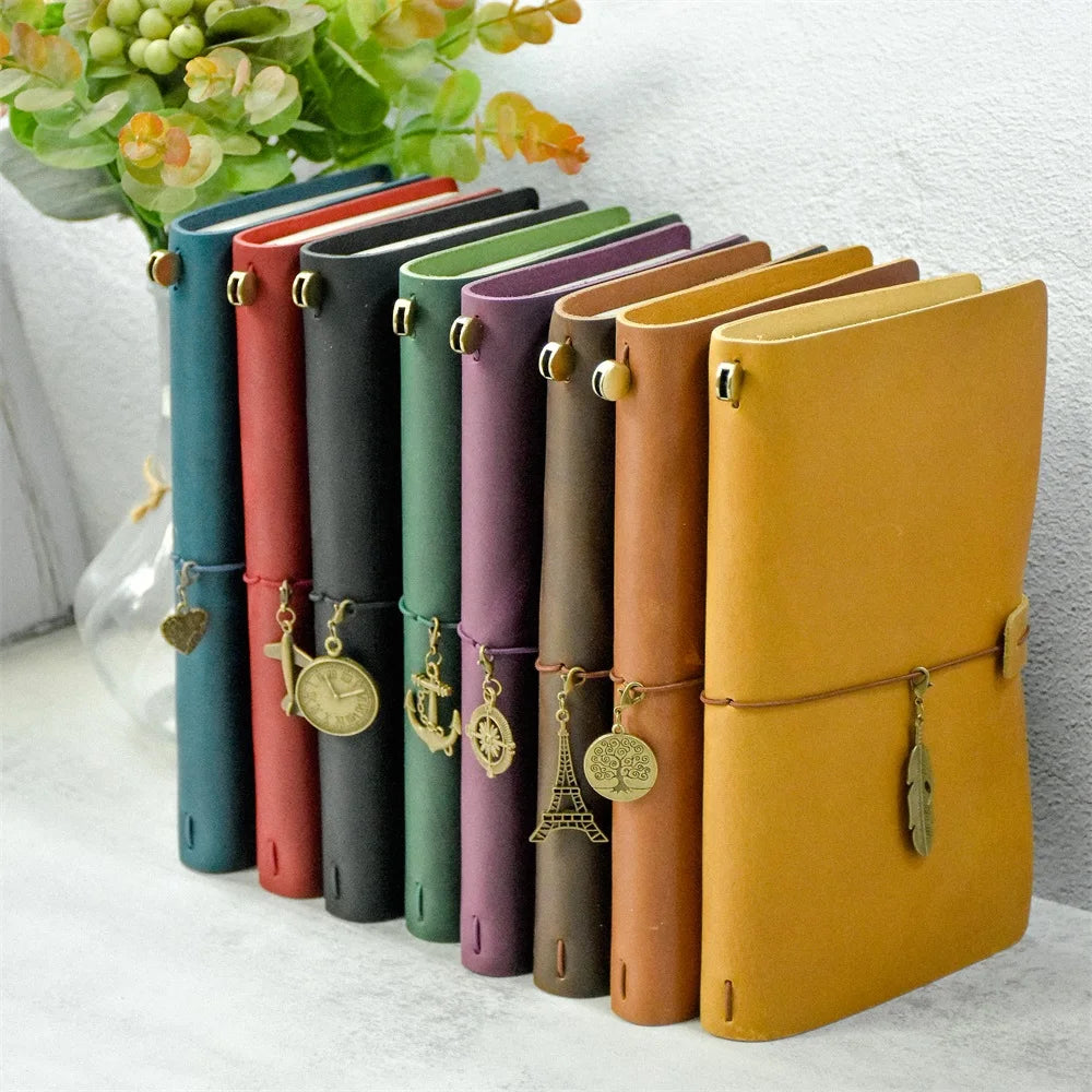 Refillable travel journal with retro handmade appearance and customisable charm accents