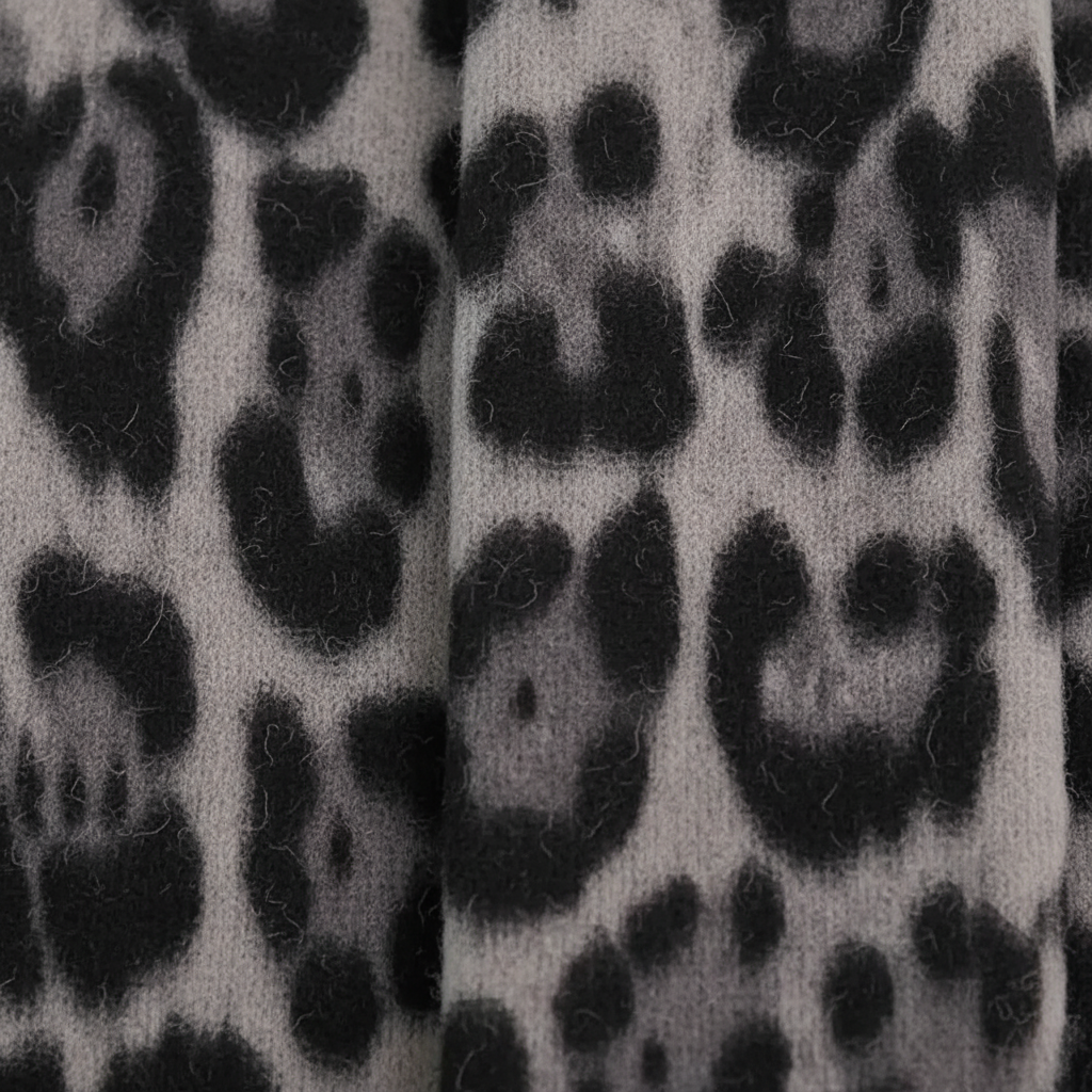 Leopard print knit shawl with tassel detailing warm winter wrap