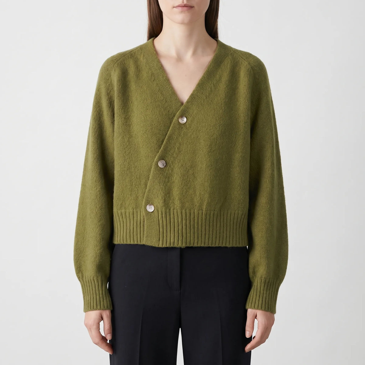 Women's asymmetrical knit cardigan with relaxed fit and cropped length