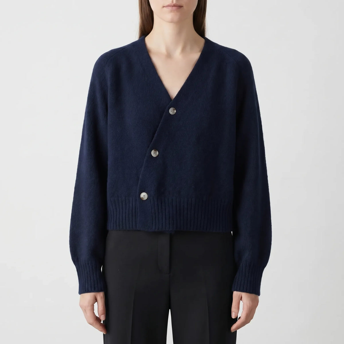 Women's asymmetrical knit cardigan with relaxed fit and cropped length