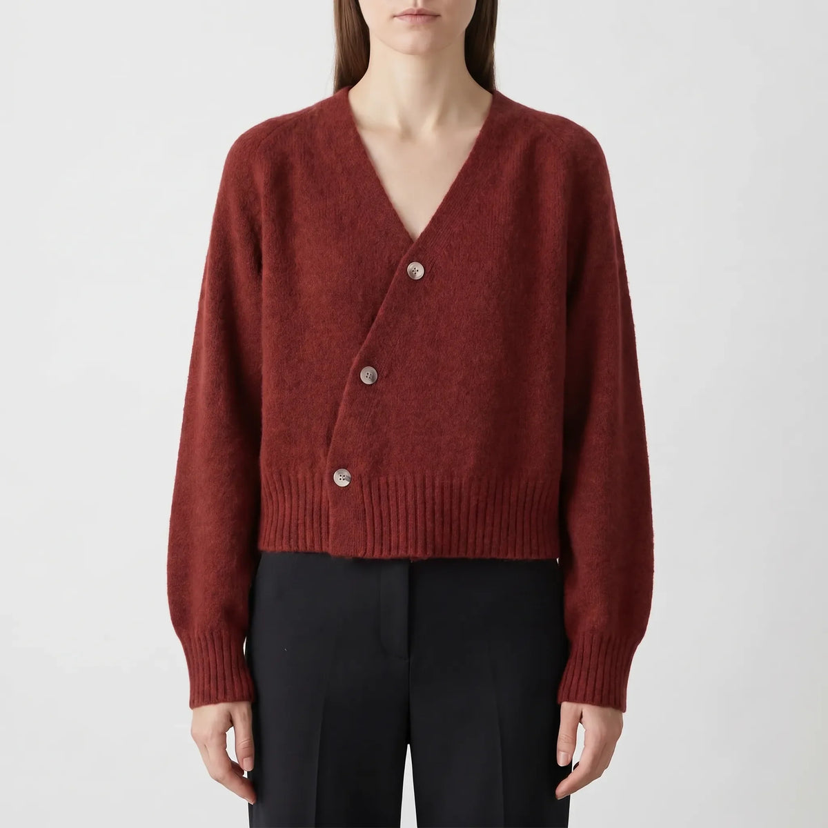 Women's asymmetrical knit cardigan with relaxed fit and cropped length