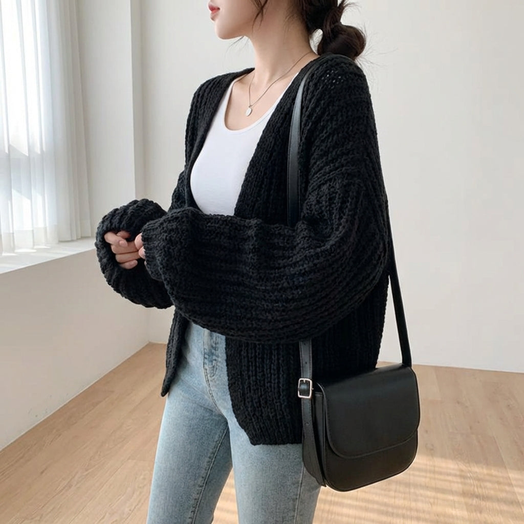 Oversized lantern sleeve cardigan with textured ribbed knit and dropped shoulders