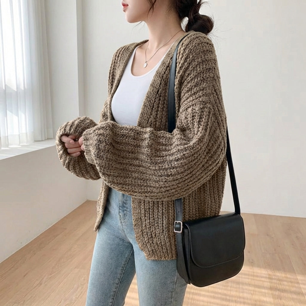 Oversized lantern sleeve cardigan with textured ribbed knit and dropped shoulders