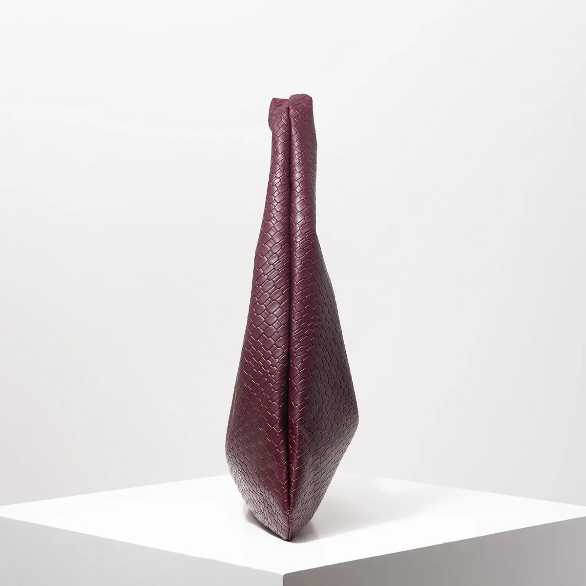 Crescent shoulder bag with faux woven leather finish and wide strap