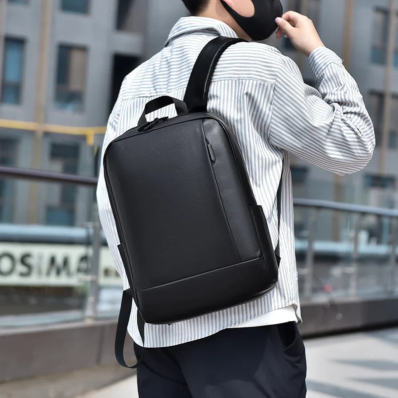 Minimalist business backpack with splash-resistant fabric and padded laptop compartment
