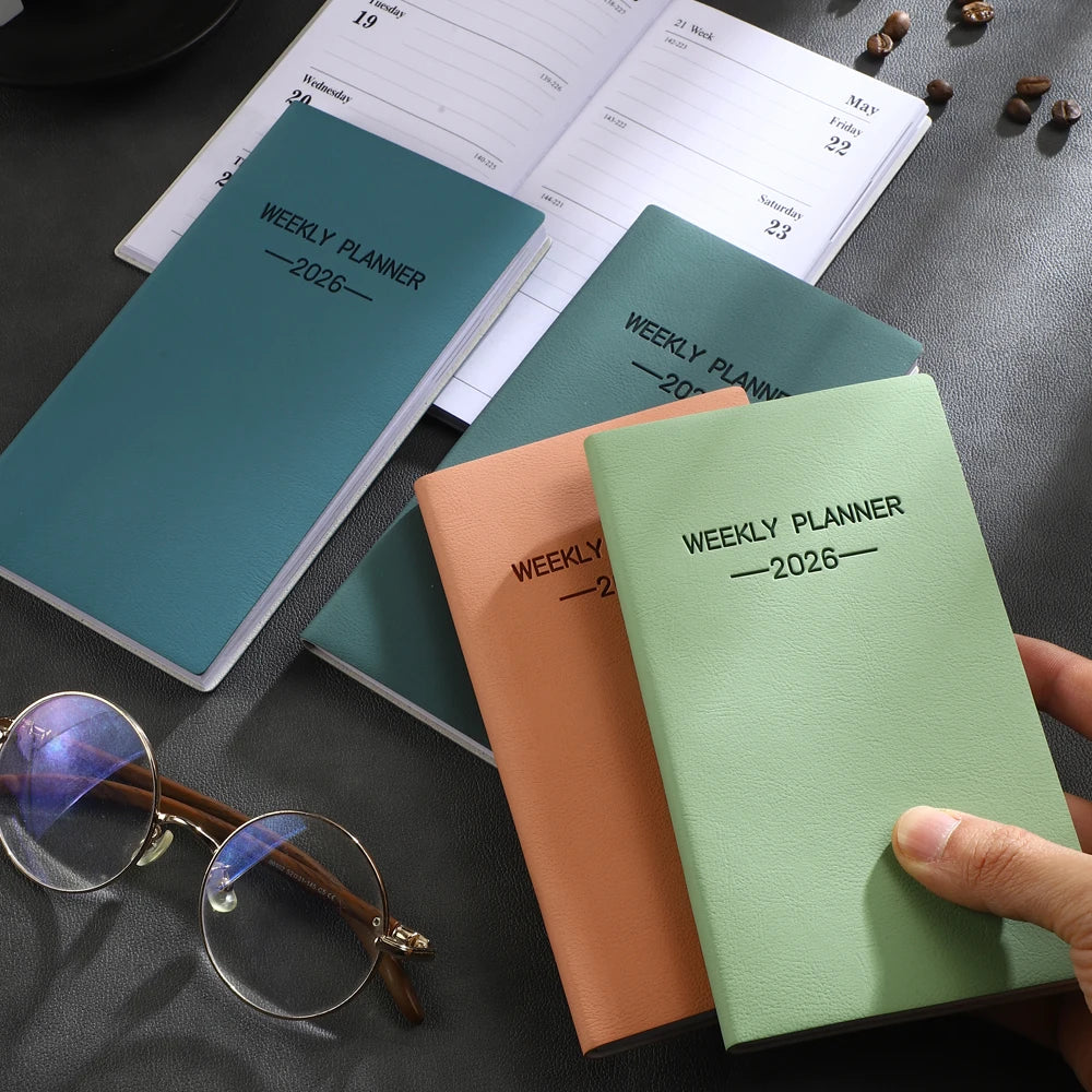 A6 weekly planner notebook with soft textured cover and smooth inner pages