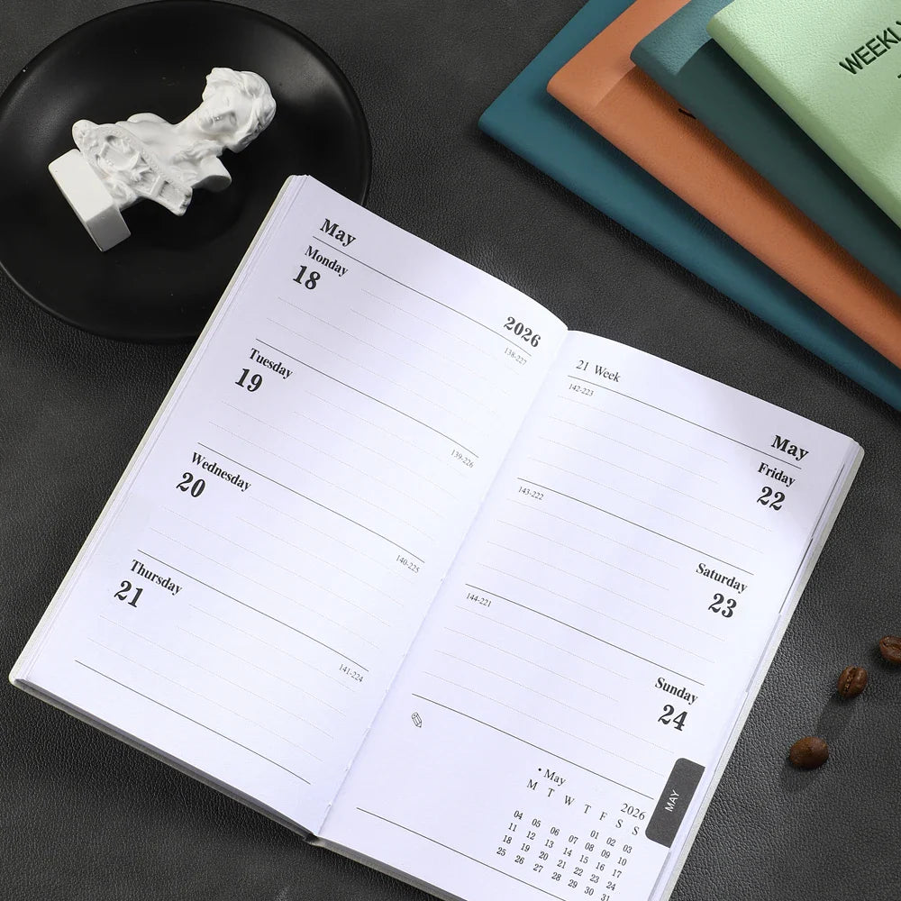 A6 weekly planner notebook with soft textured cover and smooth inner pages