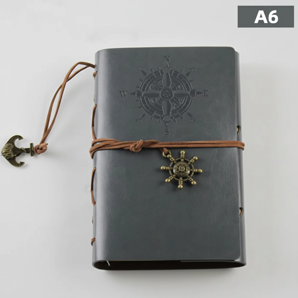 Compact refillable travel journal with vintage embossed compass design