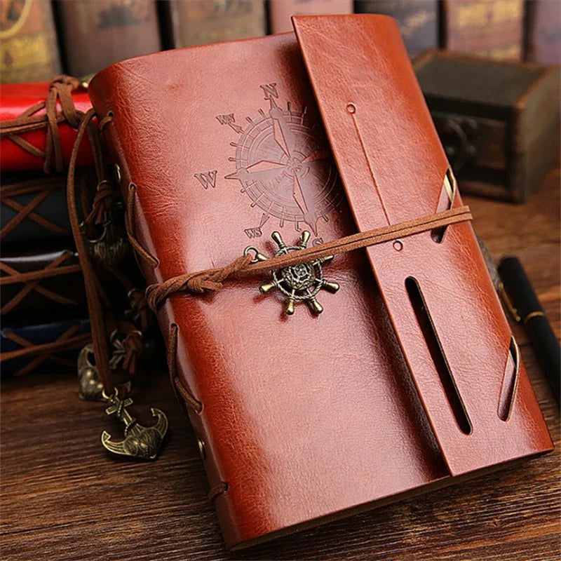 Compact refillable travel journal with vintage embossed compass design