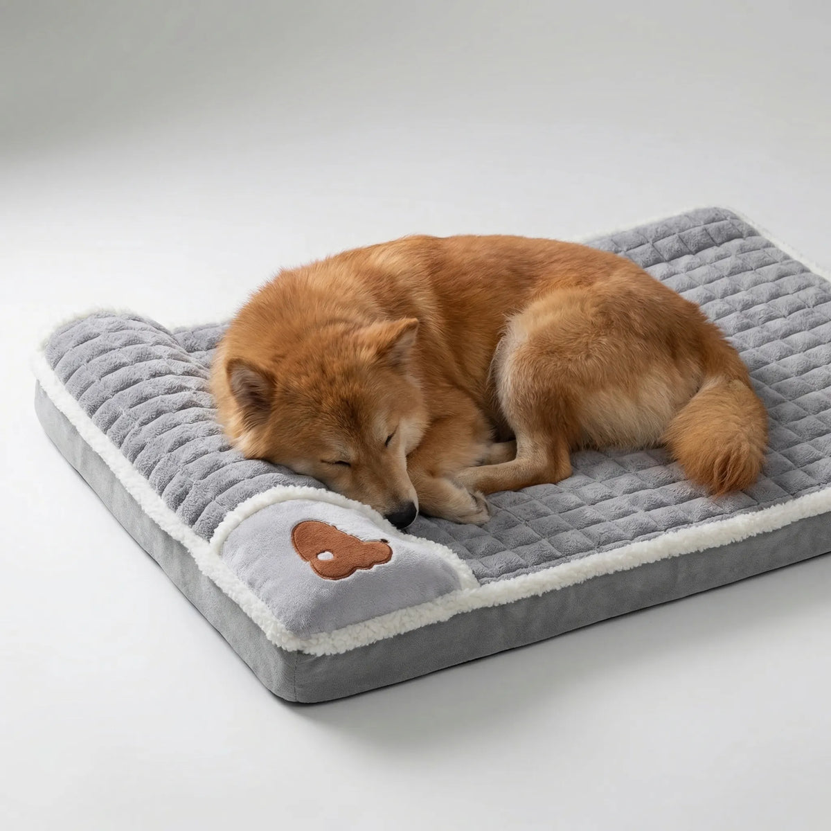 Orthopedic pet bed with memory foam and quilted surface