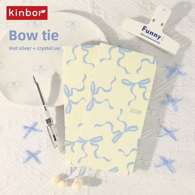 Slim weekly pocket planner with ribbon markers and note sections