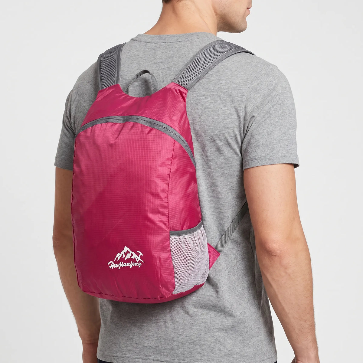 Foldable lightweight day pack with water-repellent material and ventilated mesh straps