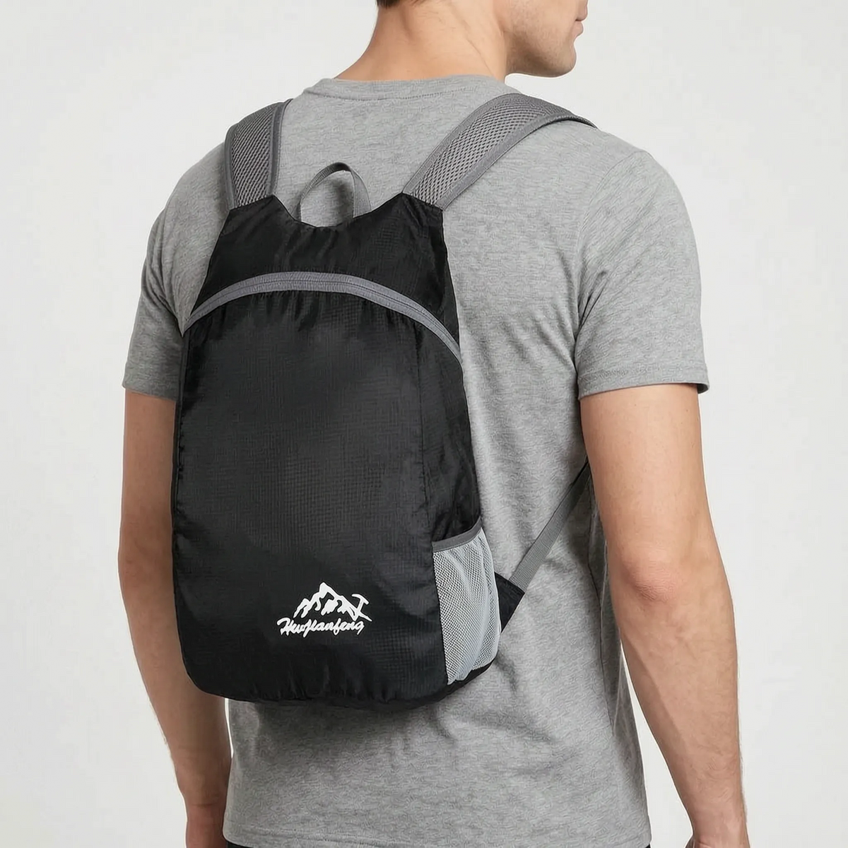Foldable lightweight day pack with water-repellent material and ventilated mesh straps