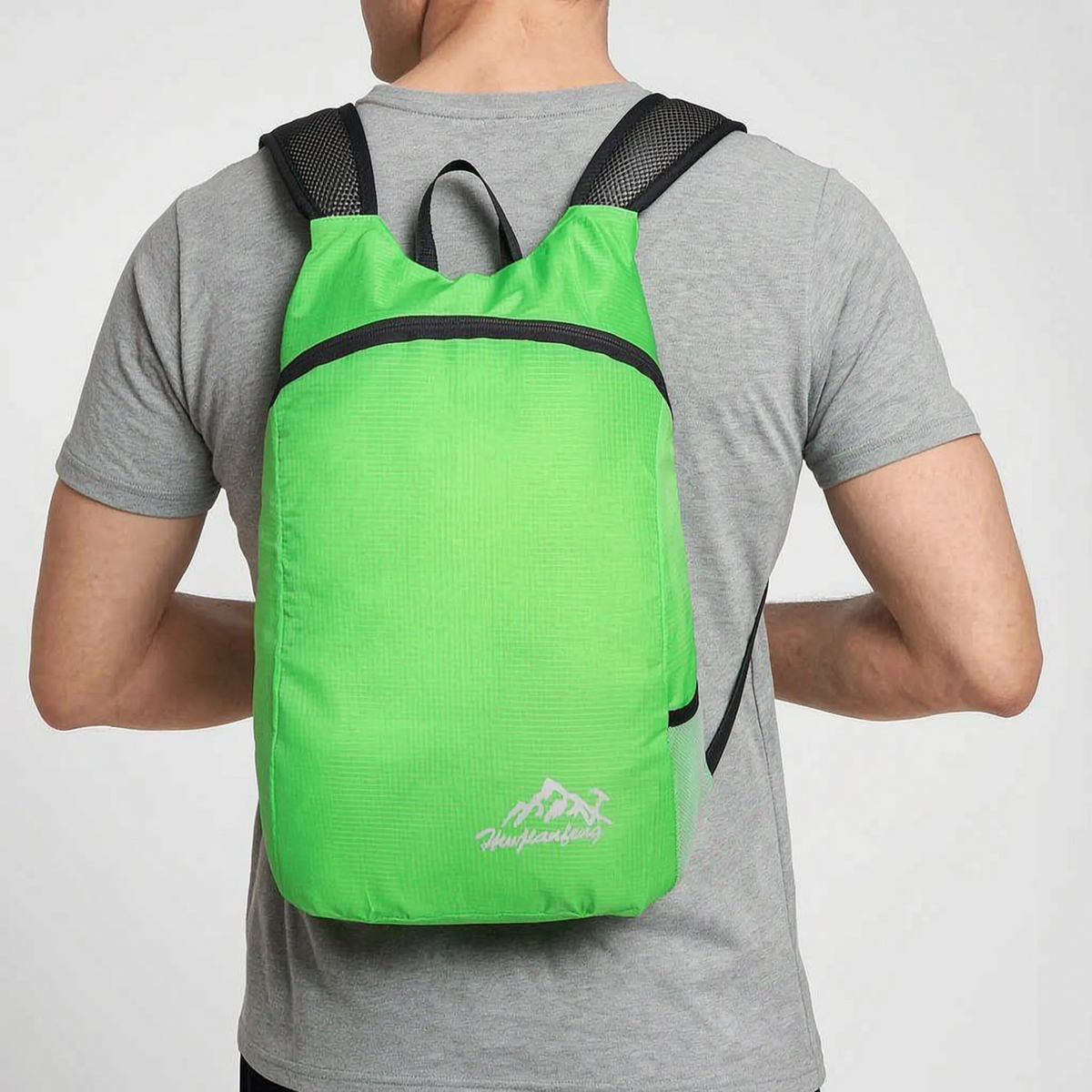 Foldable lightweight day pack with water-repellent material and ventilated mesh straps