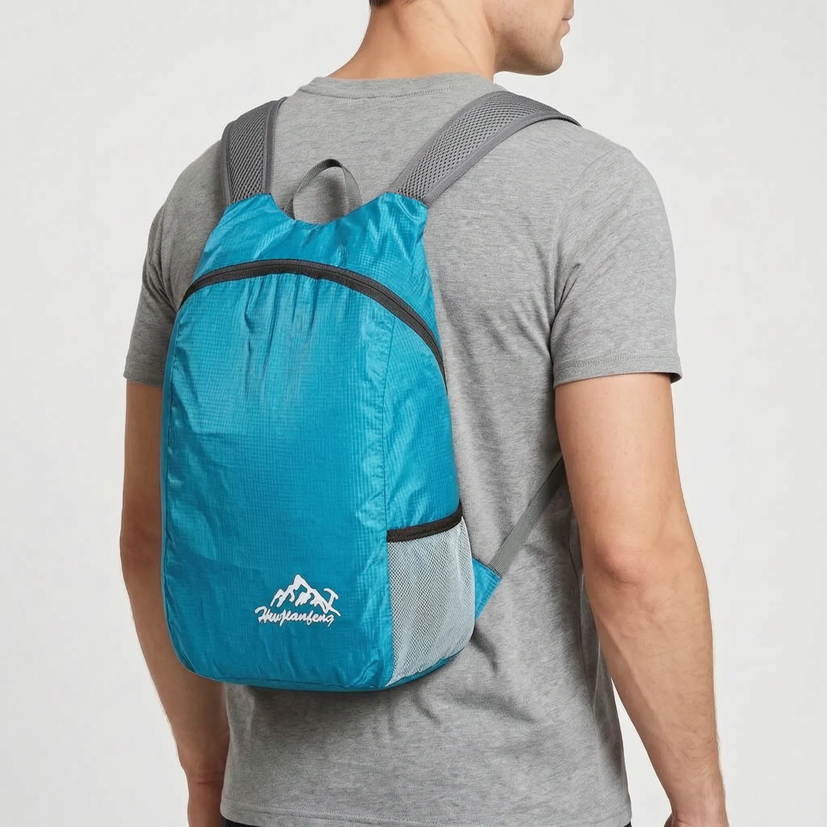 Foldable lightweight day pack with water-repellent material and ventilated mesh straps
