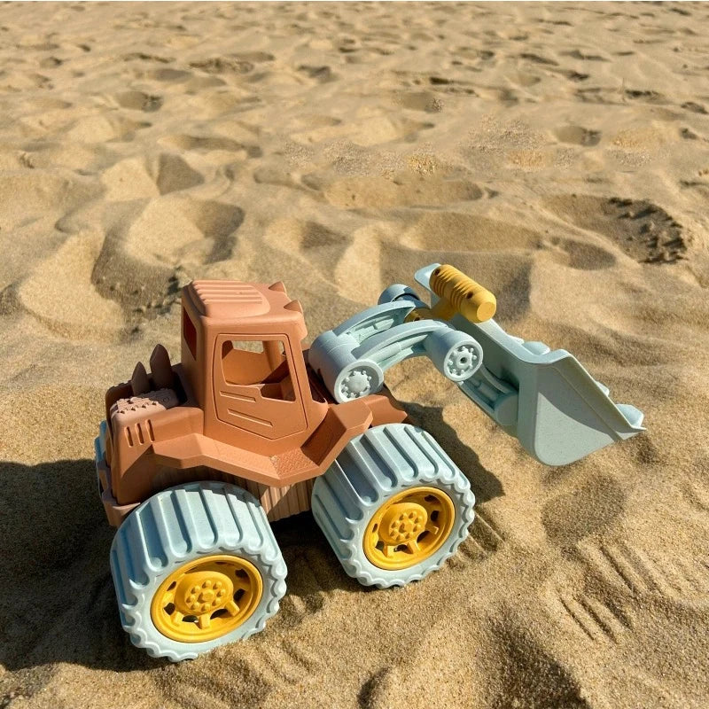 Kids sand digger toy with moving scoop for beach and sandpit play