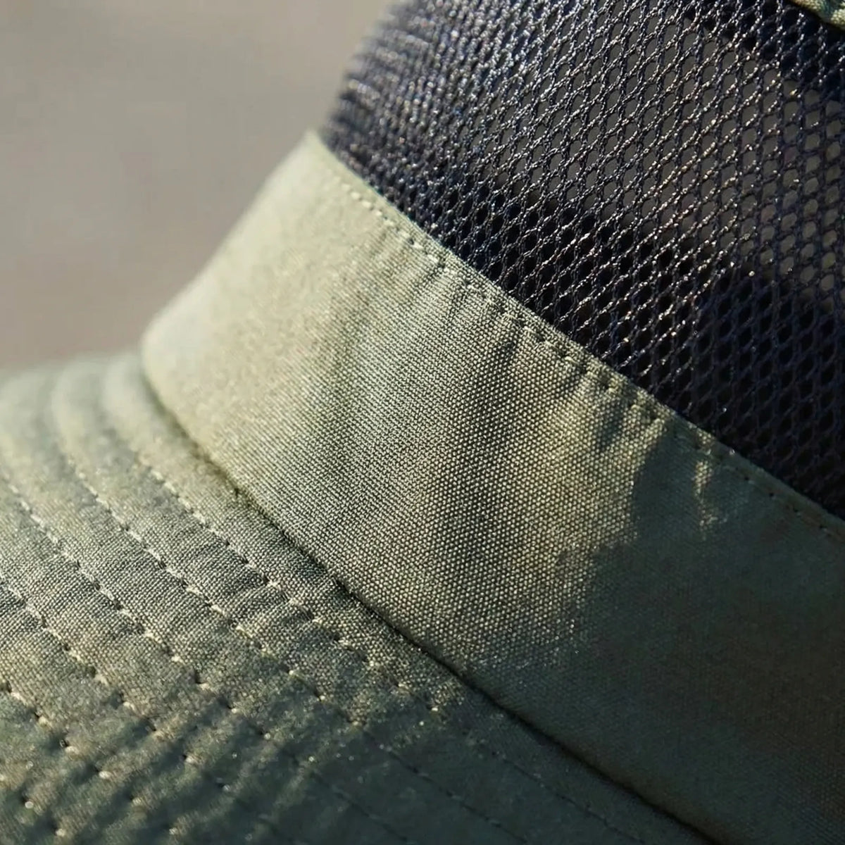 Wide-brim outdoor sun hat with mesh ventilation and adjustable chin cord