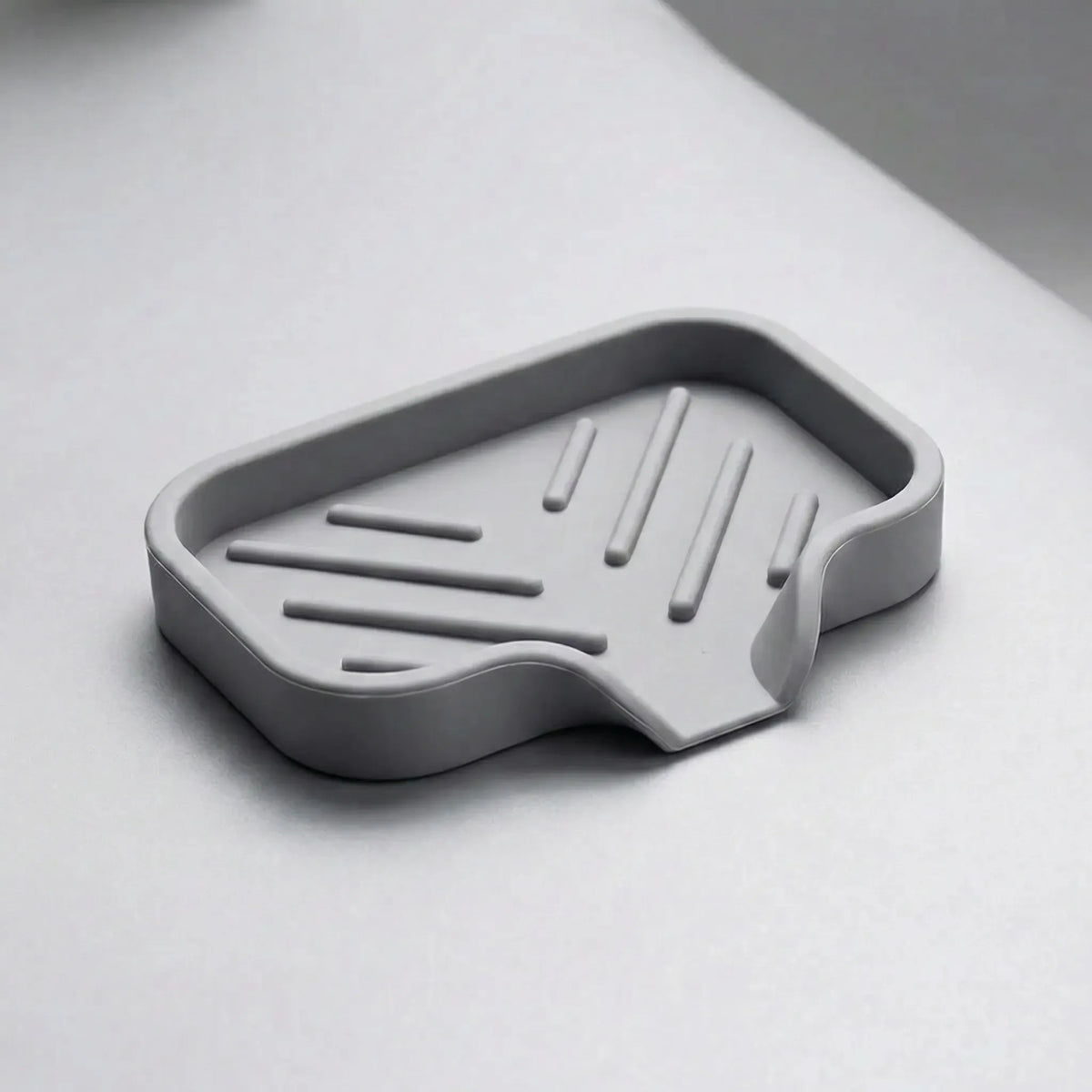 Sink edge organiser with drain channel and raised ribs for drying