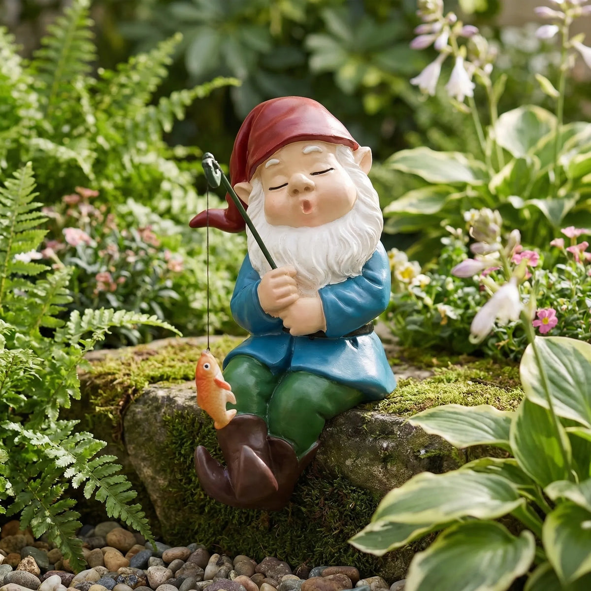 Hand-painted sleeping fishing gnome garden ornament with dangling fish