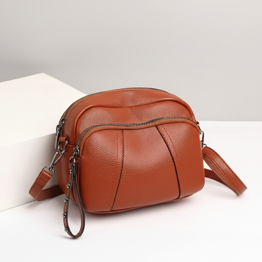 Small pebble leather crossbody bag with adjustable strap