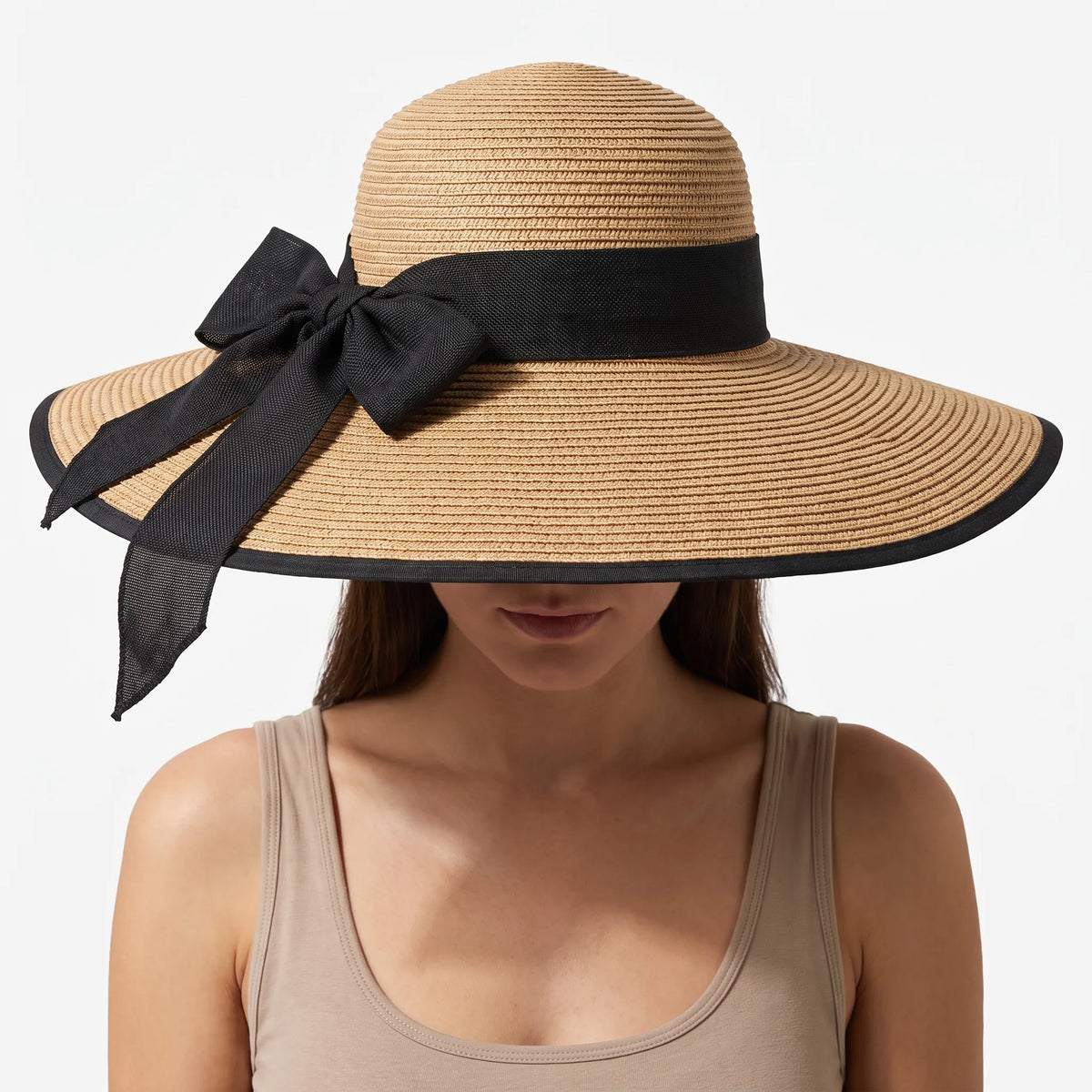 Wide brim sun hat with lightweight woven construction and decorative bow