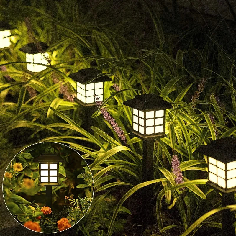 Solar-powered pathway lantern with warm amber glow and pagoda-style design