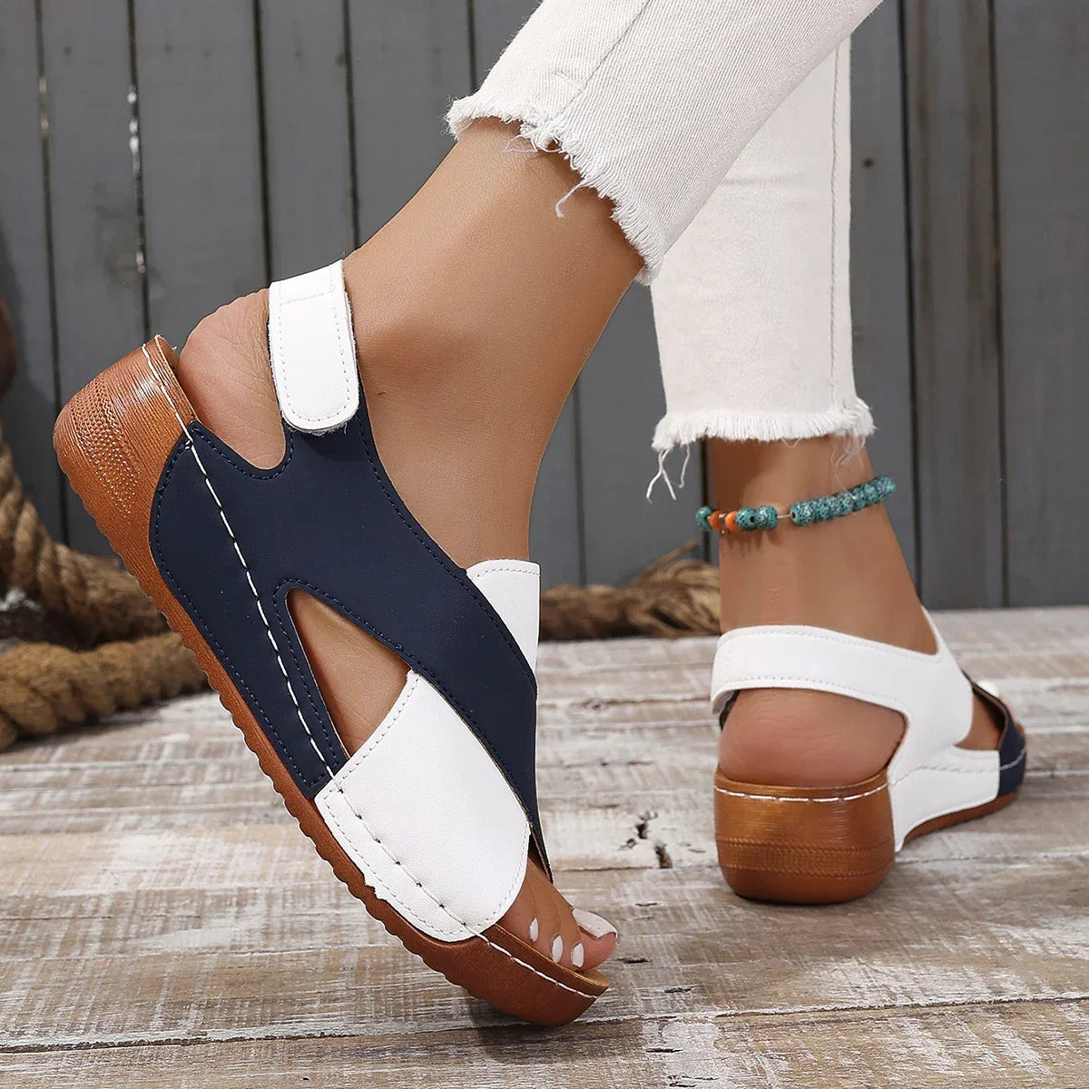 Women's wedge sandals with cross-strap design and slip-on strap