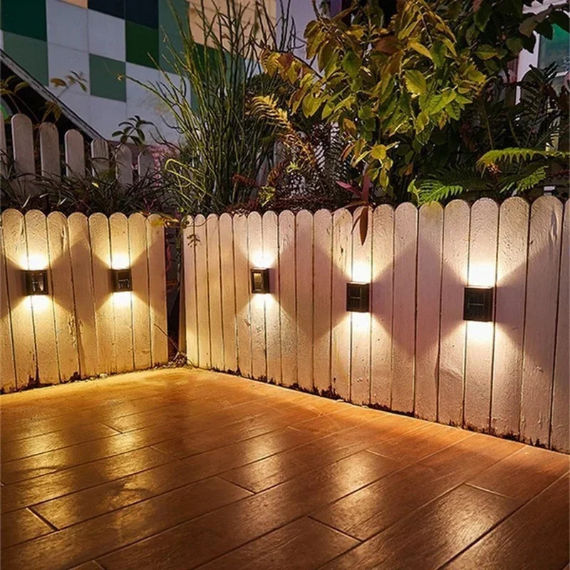 Solar powered up-down wall light with dual beam warm glow