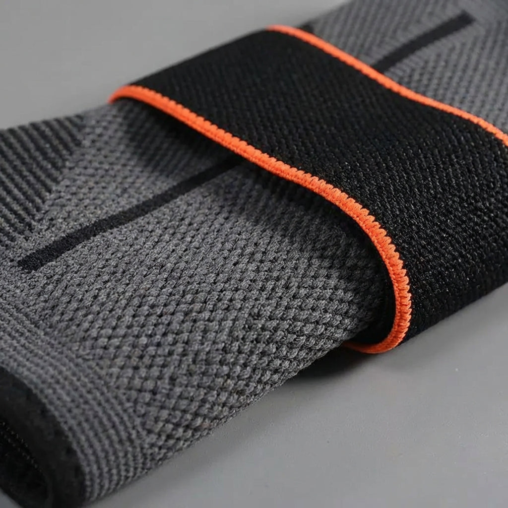 Adjustable compression ankle sleeve with stabilisation support