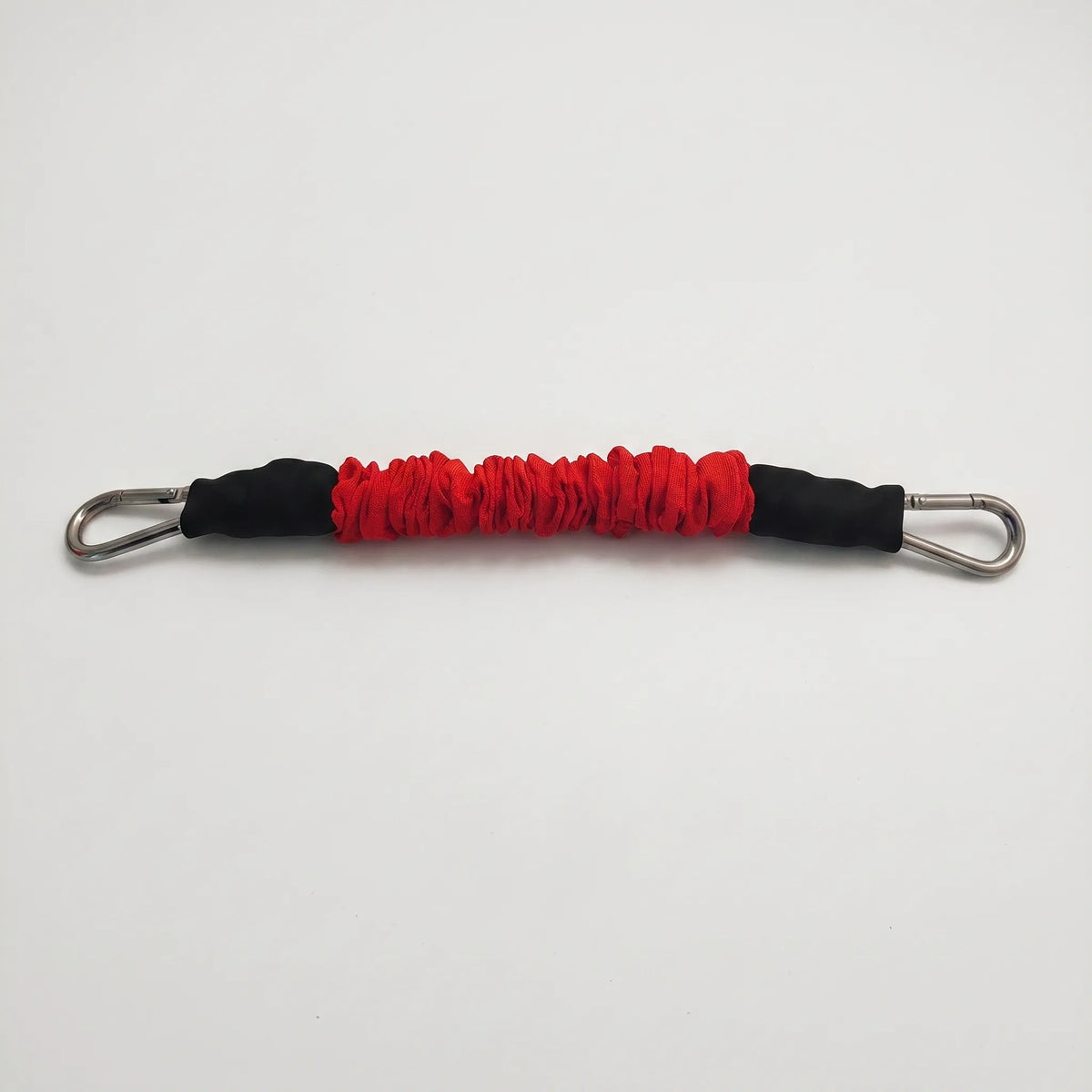 Fabric covered resistance band with metal carabiner clips and progressive tension