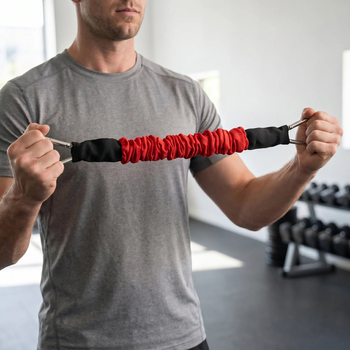 Fabric covered resistance band with metal carabiner clips and progressive tension