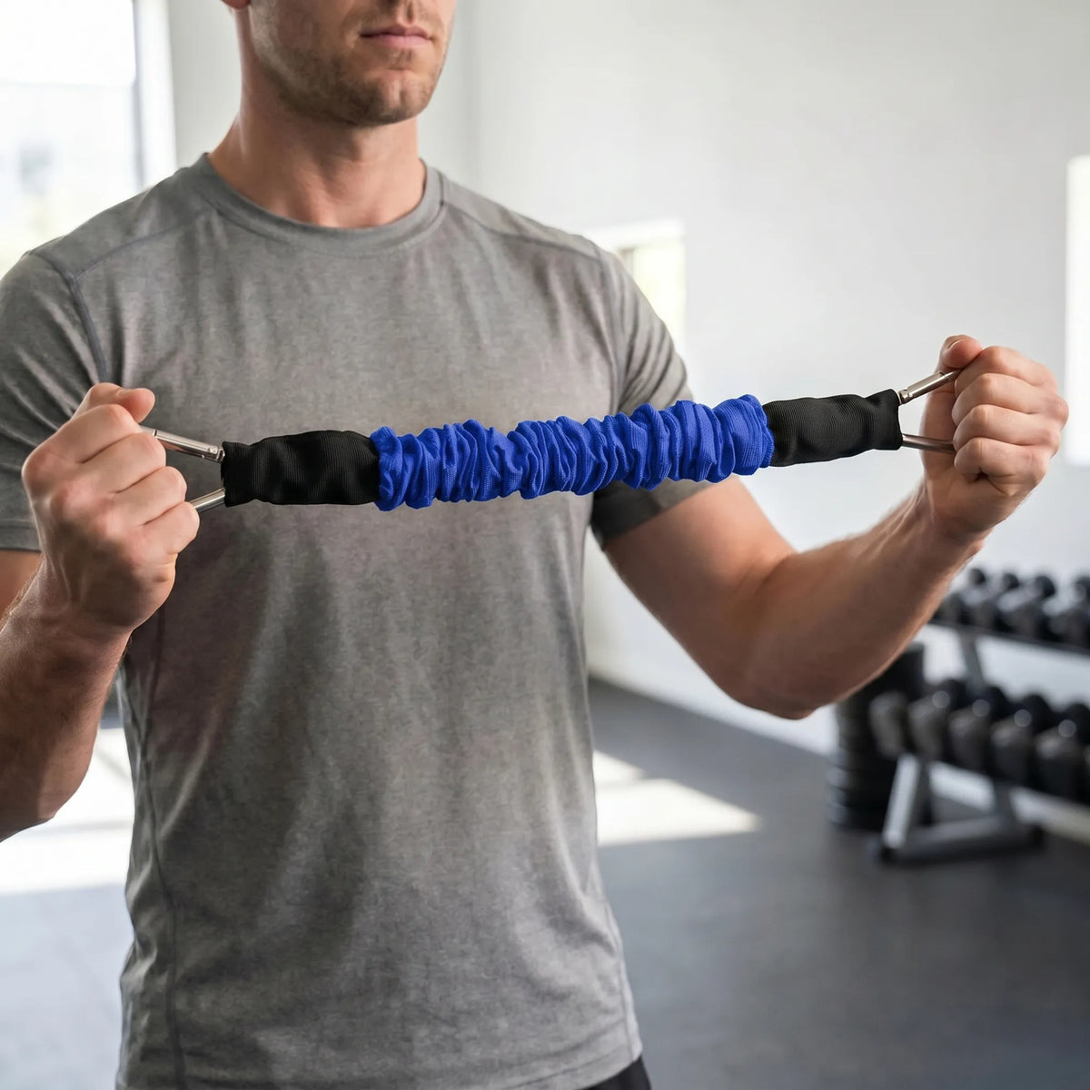Fabric covered resistance band with metal carabiner clips and progressive tension