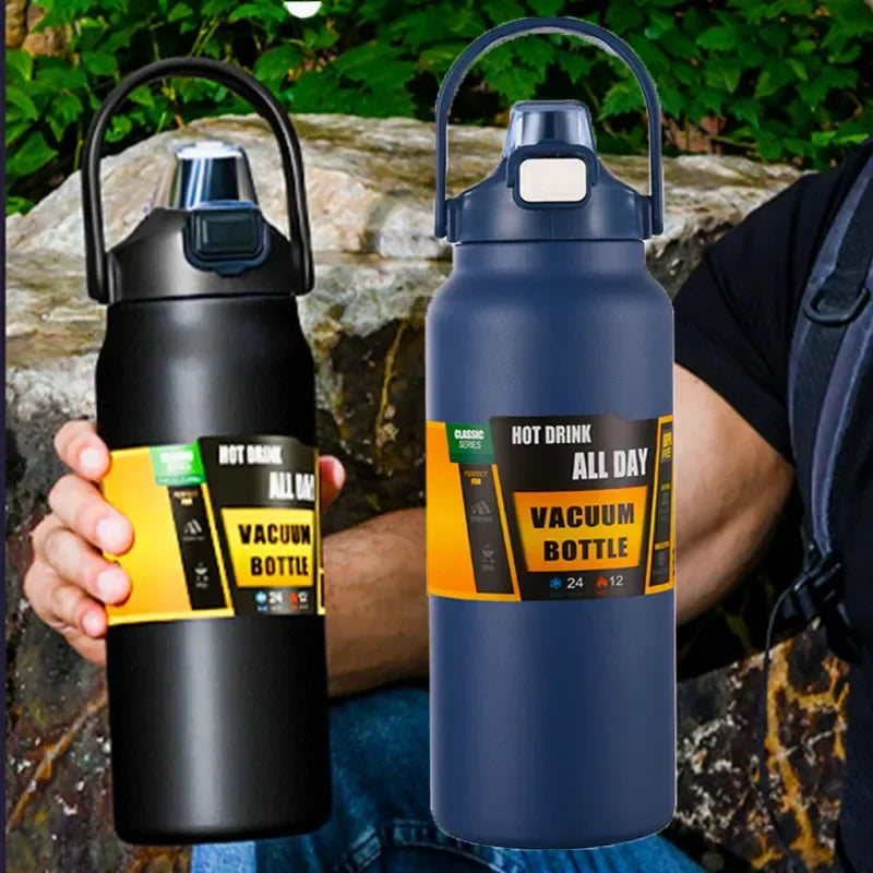 Large stainless steel vacuum bottle with ergonomic handgrip