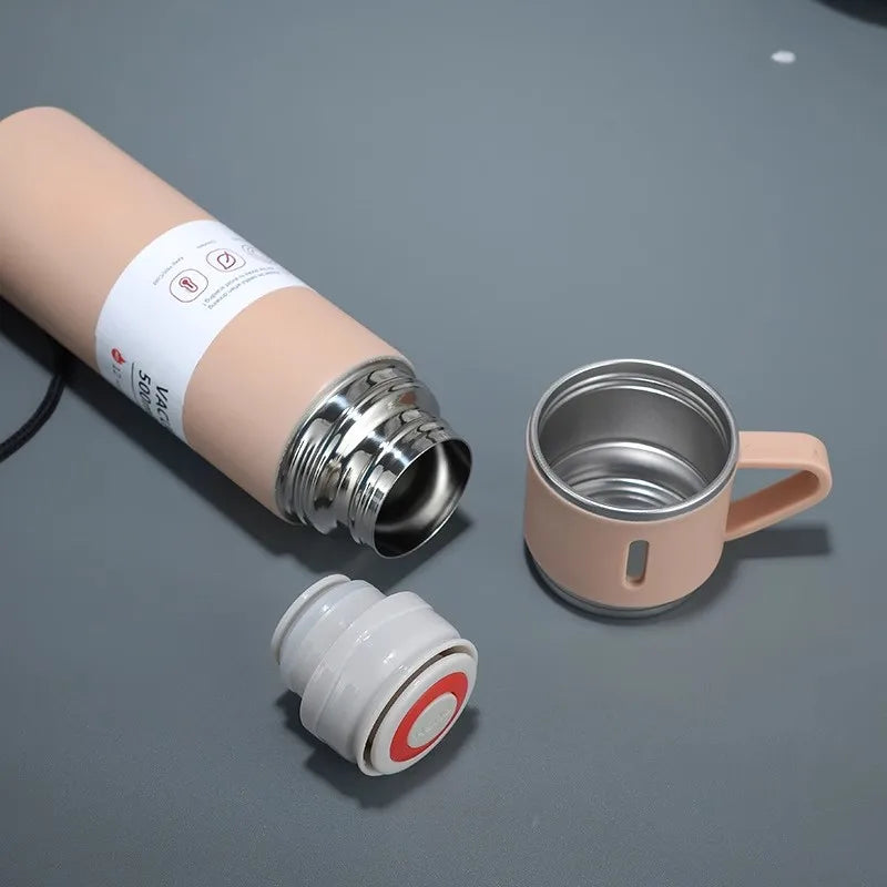 Stainless steel vacuum insulated bottle with matching mugs for travel